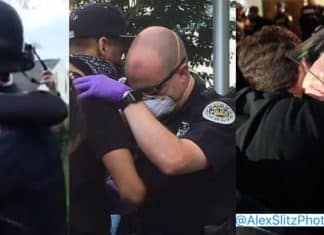 Policiais e manifestantes se abraçam durante manifestações contra violência policial nos Estados Unidos