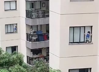 Vizinhos flagram criança pendurada em janela de edifício; veja o vídeo!